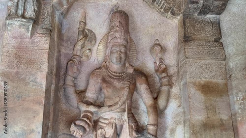 Majestic Lord Vishnu sculpture from Badami Cave No. 3, carved in red sandstone, depicting divine grace, intricate ornaments, and superb Chalukyan artistry from the 6th–7th century