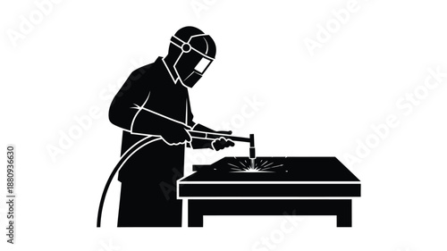 A welder working with metal sparks flying from the weld silhouette