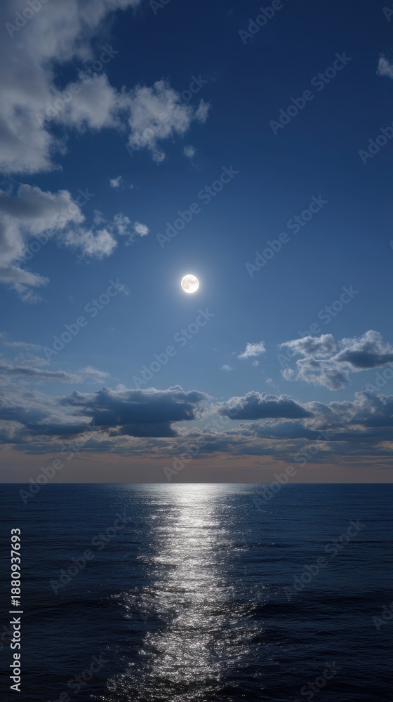 Obraz premium Dramatic Vertical View of Shining Moonlight Through Cloud Layers Over Ocean