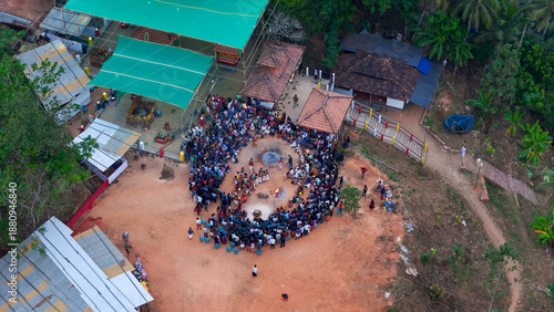 Wallpaper Mural The spirit of Malabar: Devotees gathered for a Theyyam ritual performance amidst the beautiful nature Torontodigital.ca