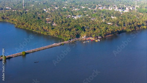 Wallpaper Mural A beautiful road in Payyannur, surrounded by green trees, open sky, and calm village life.  Torontodigital.ca