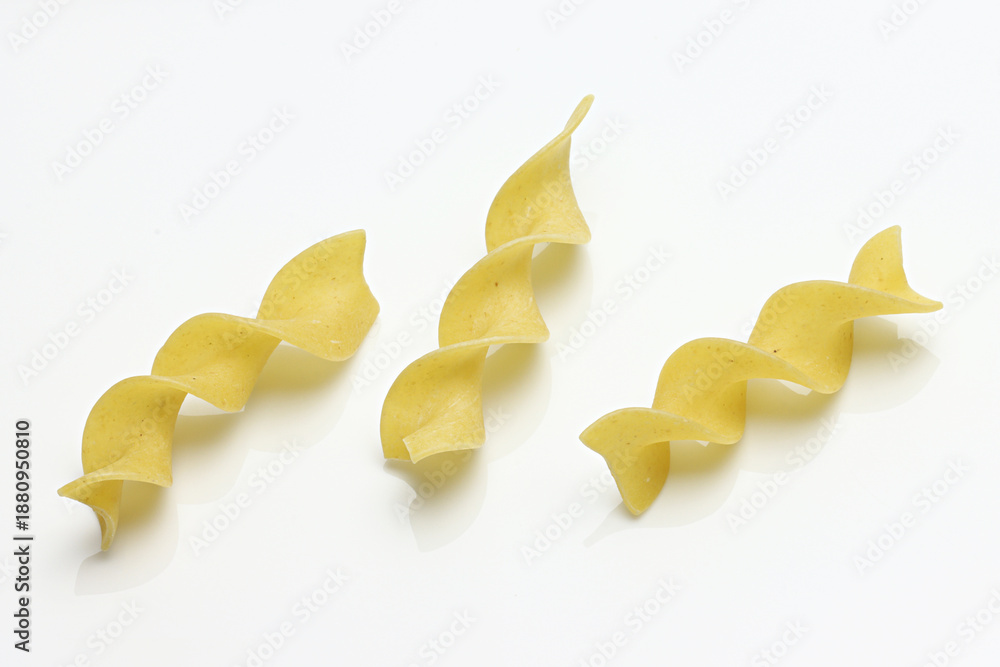 Fototapeta premium Uncooked Egg Noodles isolated on white background