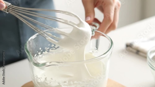 Wallpaper Mural Woman whisking ingredients in glass bowl in bright kitchen setting Torontodigital.ca