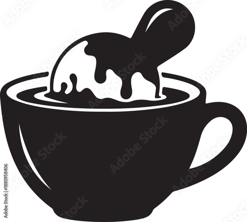 Coffee cup with milk being poured into it from a spoon