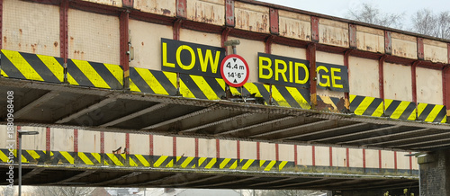 Low Bridge warning on a UK railway bridge. 