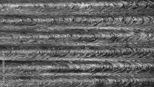 Metallic rough abstract textured background of horizontal parallel welded seams, industrial concept background