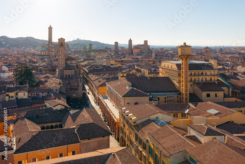 Tableau sur toile Bologna Italy cityscape with historic towers and terracotta rooftops under a cle