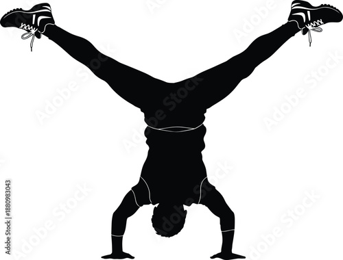 Silhouette of athletic man doing handstand with legs split in V shape, showcasing balance, strength, fitness, and body control outdoors