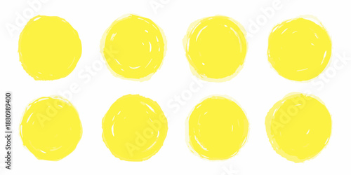 A collection of eight vibrant yellow softly textured circular shapes arranged simply