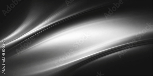 Abstract black and white background featuring smooth flowing waves of silk texture and dark metallic light motion