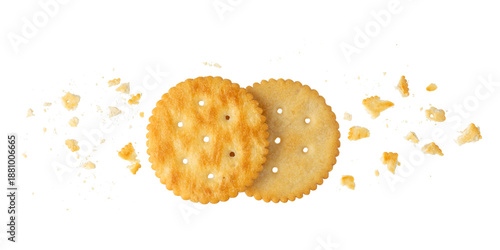 Round crispy cracker cookies with crumbs isolated on white
