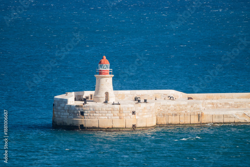 A lighthouse in the sea on the island of Malta, Valletta.