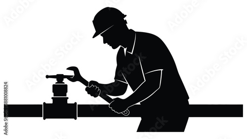 A construction worker repairing a pipeline a striking black silhouette