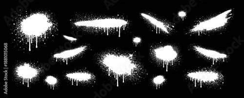 Set of white spray paint splashes and drips on black background. Perfect for urban graffiti and street art designs.