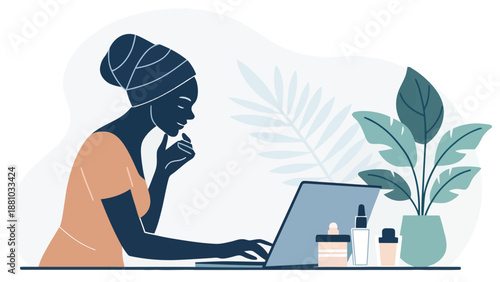 Woman working on laptop with beauty products and plant nearby