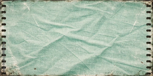 Vintage background with old paper and lace features a blue grunge texture and frozen winter frost patterns on a rough marble surface material