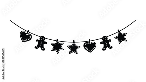 A black and white garland featuring gingerbread men hearts and stars hanging on a line