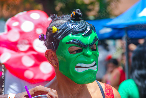 A person wearing a superhero mask at Olinda Carnival in Brazil