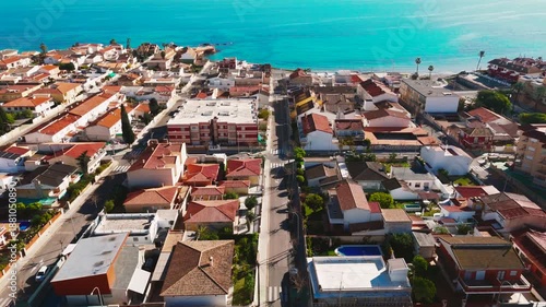 Aerial view of Torre de la Horadada townscape with Mediterranean Sea view during sunny day. Spanish resort, travel and touristic places concept. Costa Blanca, Alicante province, Spain 
