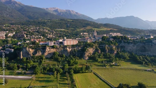 Aerial view of Embrun and its famous cliff-top plateau. Summer in Hautes-Alpes, French Alps, France
