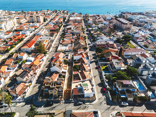Aerial view of Torre de la Horadada townscape with Mediterranean Sea view during sunny day. Spanish resort, travel and touristic places concept. Costa Blanca, Alicante province, Spain 