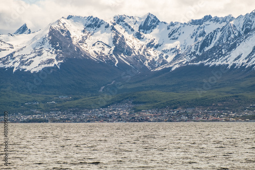View of town in expansion Ushuaia, its coastline, the Martial Glacier and the Beagle Channel, Argentina