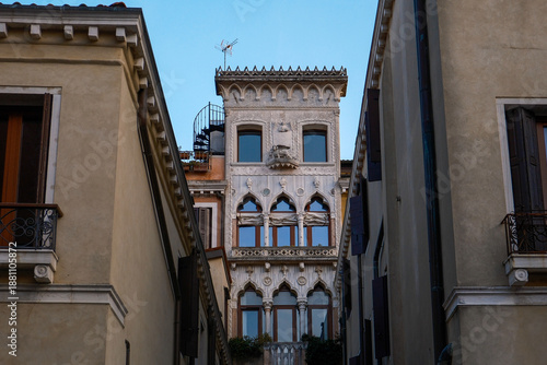 Gothic Architecture of Palazzo Contarini del Bovolo in Venice, Italy, Detailed View of Historic Venetian Facade and Famous Spiral Staircase Tower under Blue Sky