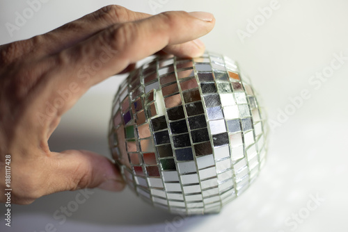 Mirror ball. A ball of small mirrors.