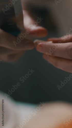 Woman peeling and mincing garlic in the kitchen