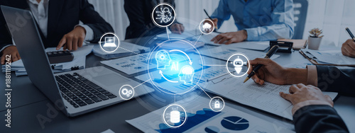 Fotografie Team members collaborate in a modern office setting, utilizing advanced technology and data analysis, highlighting the role of artificial intelligence in business strategies