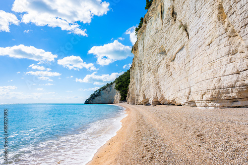 Wallpaper Mural Majestic white limestone cliffs towering over a quiet pebble Vignanotica beach on the Gargano coast, Apulia, Italy Torontodigital.ca