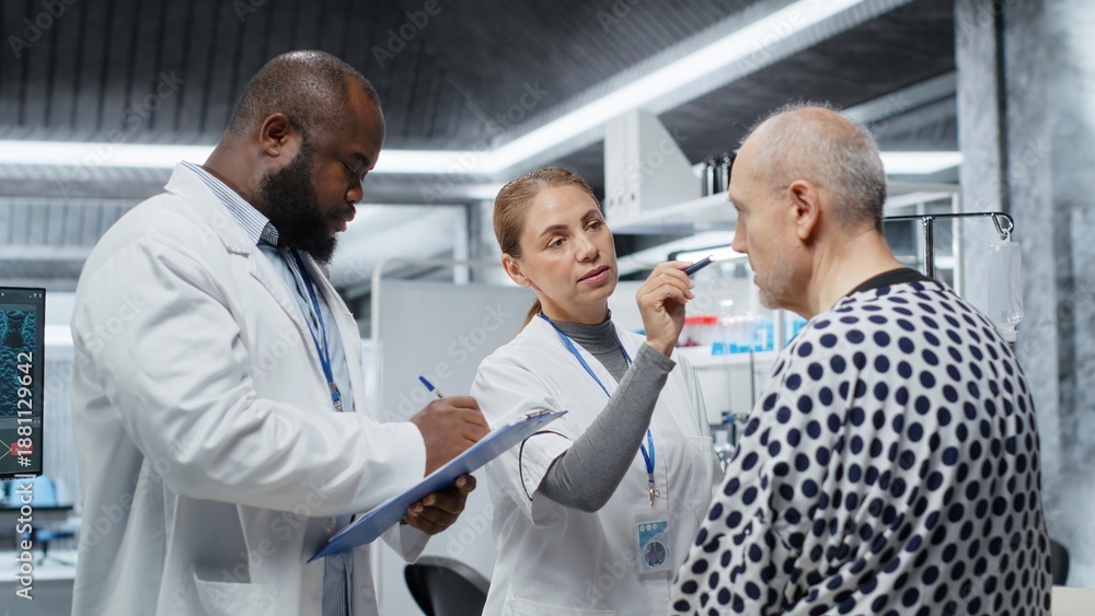 Fototapeta premium Laboratory experts analyzing a patient vitals during drug testing, evaluating treatment safety, dosage reactions and side effects in a study. Innovation and prevention in healthcare. Camera B.
