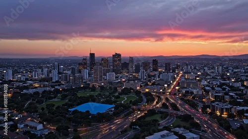 Epic aerial view of a bustling city skyline during a vibrant sunset over the urban landscape