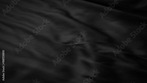 Luxurious black satin fabric billowing gently creating smooth flowing textures for abstract backgrounds