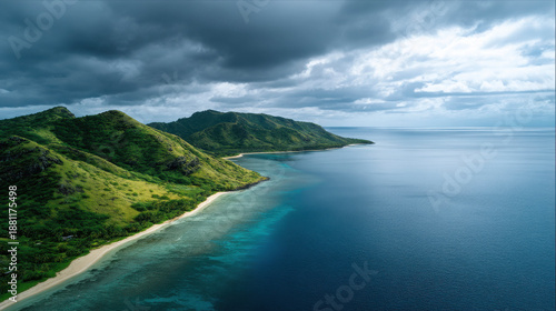Aerial View of Lush Tropical Coastline with Turquoise Waters and Dramatic Sky Over Serene Ocean