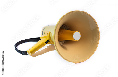 Yellow megaphone or bullhorn isolated on a white background. A portable loudspeaker with a black strap used for announcements, protests, and directing crowds