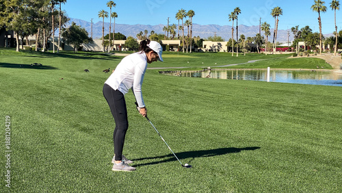 Woman Golfer on Palm Springs Golf Course on Sunny Day