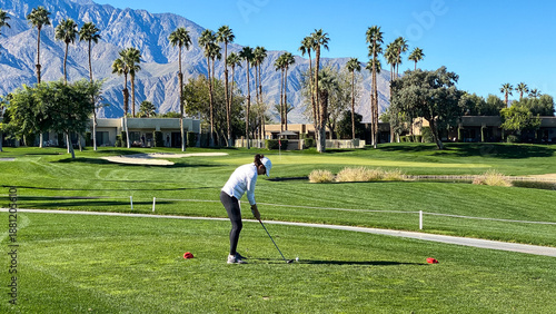 Woman Golfer Teeing Off on Palm Springs Golf Course