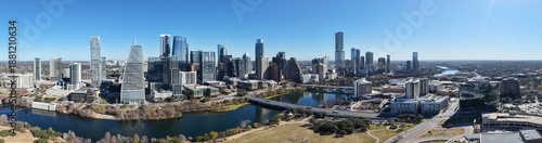 Panoramic Austin Skyline with Kayaks and Boats on Lady Bird Lake under Sunny Blue Sky