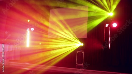 Yellow Stage Light Beams Shining into the Hall and Flickering on an Empty Scene