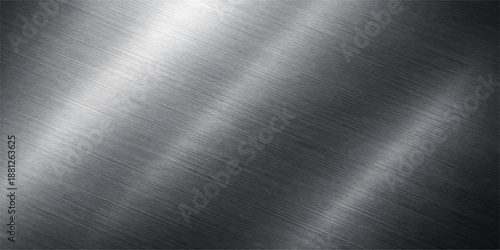 Polished silver stainless steel plate with a shiny brushed metal texture and industrial grey aluminum surface pattern featuring light metallic reflections