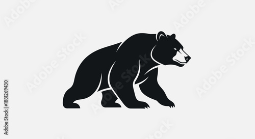 Black bear silhouette walking against a white background concept image