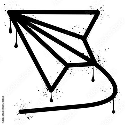 Paper airplane graffiti with black spray paint splatter.