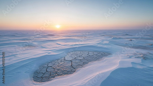 Wallpaper Mural Ethereal dawn over a vast, frozen expanse, revealing intricate patterns of cracked earth nestled within pristine snowdrifts as the golden sun rises Torontodigital.ca