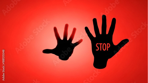Stop hand silhouette against red background.