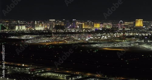 Las Vegas Nevada Aerial v118 zoomed flyover paradise capturing airport runway and Strip's cityscape, highlighting the vibrant nightlife of the desert city - Shot with Mavic 3 Pro Cine - May 1st 2024
