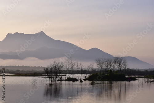Reservoir with a mountain backdrop,reservoir featuring a large mountain formation in the background, Khlong Hin Reservoir, Krabi