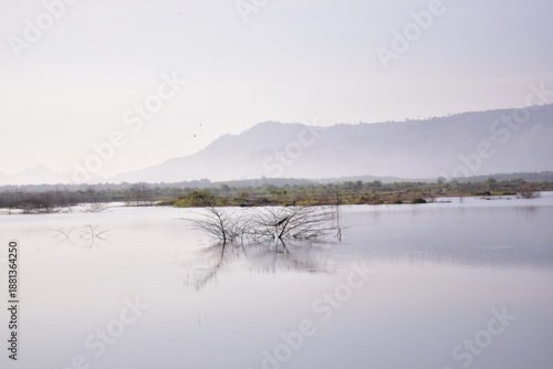Reservoir with a mountain backdrop,reservoir featuring a large mountain formation in the background, Khlong Hin Reservoir, Krabi
