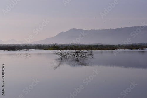 Reservoir with a mountain backdrop,reservoir featuring a large mountain formation in the background, Khlong Hin Reservoir, Krabi