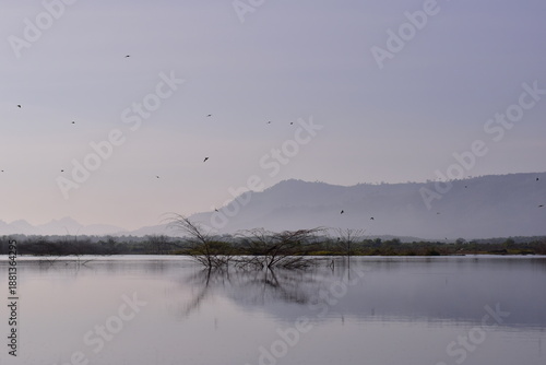 Reservoir with a mountain backdrop,reservoir featuring a large mountain formation in the background, Khlong Hin Reservoir, Krabi